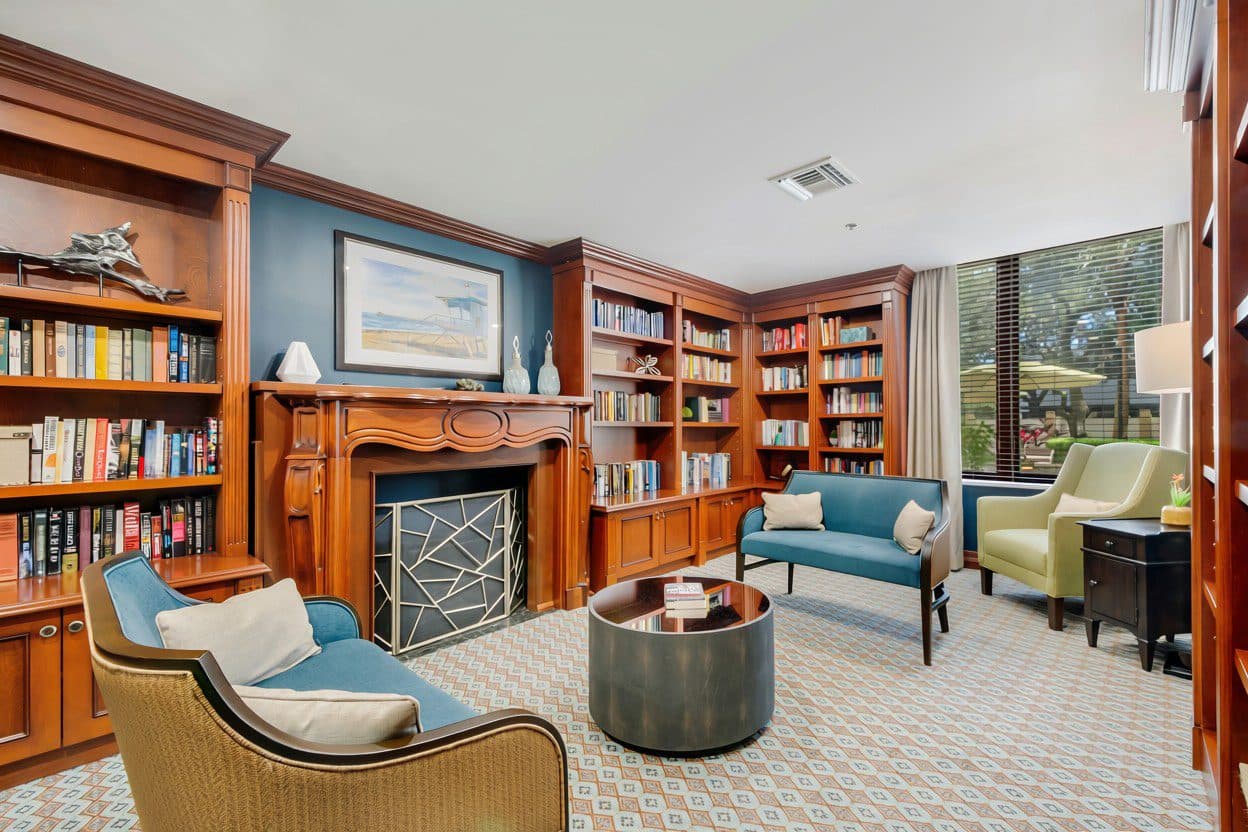 Library lounge with fireplace and seating